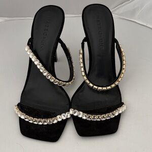 Elegant Black Heels with Gold Accents